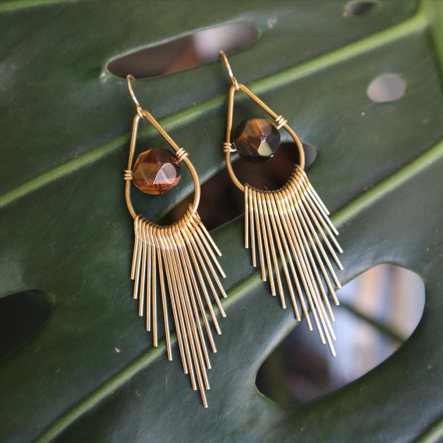 Eye discount tassel earrings